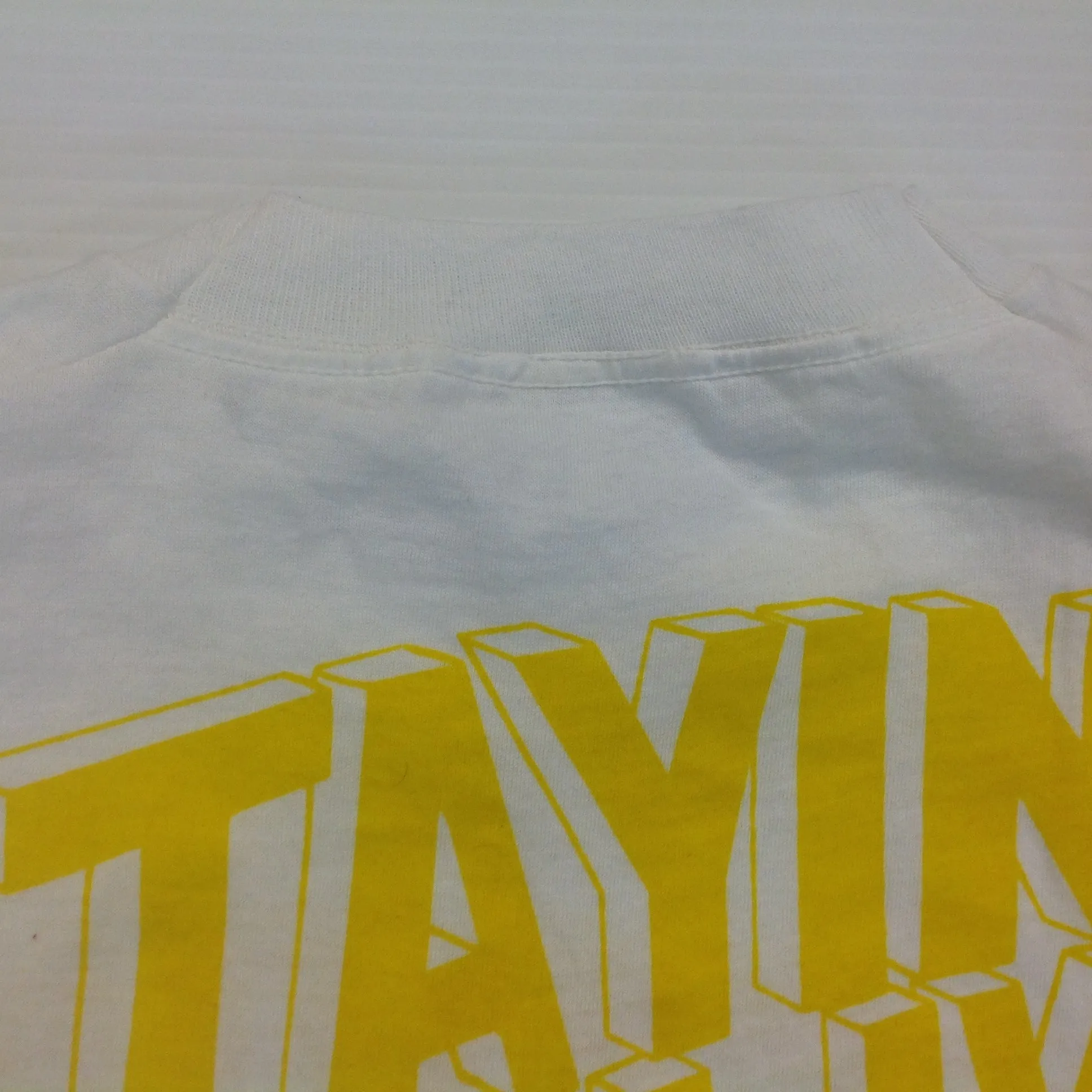 Vintage 1980's Novelty T-Shirt STAYING ALIVE IN 85 Yellow on White Katharine Hamnett