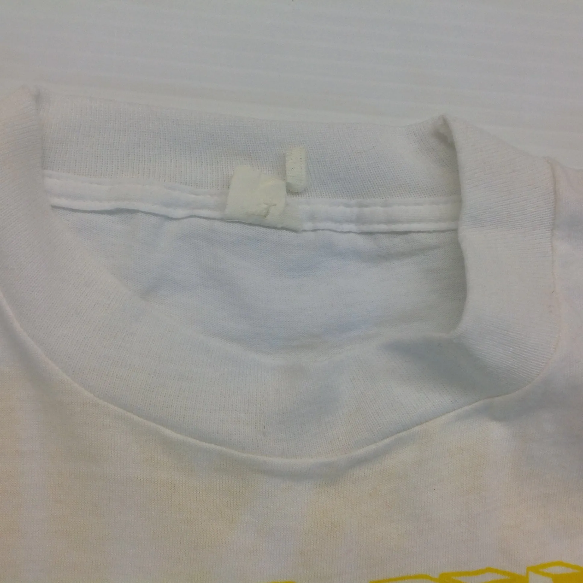 Vintage 1980's Novelty T-Shirt STAYING ALIVE IN 85 Yellow on White Katharine Hamnett